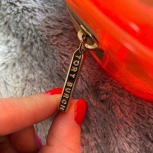 Neon Orange Tory Burch cosmetic case